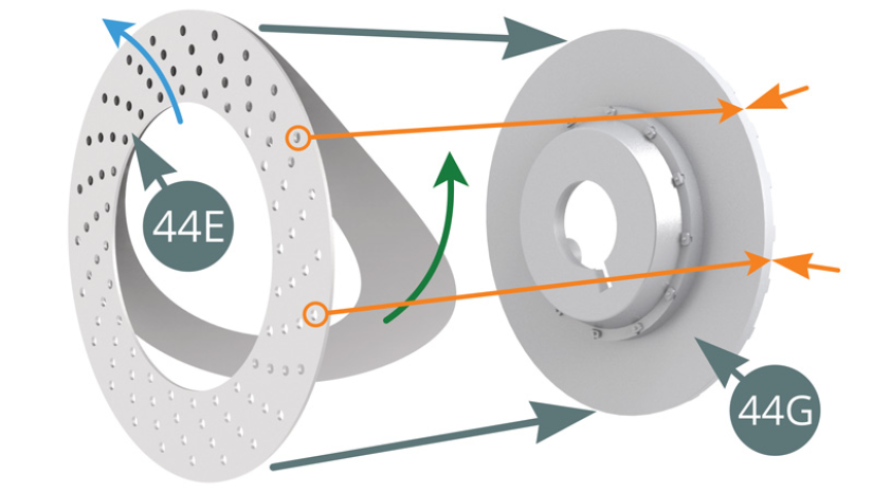 Remove the paper backing (green arrow) from the surface of the Brake disc (44E) - note the direction of the ventilation holes, blue arrow - and apply the adhesive to the outer Brake half disc (44G). Ensure that the outer holes are in front of the ribs of the disc (44G) - orange arrows.