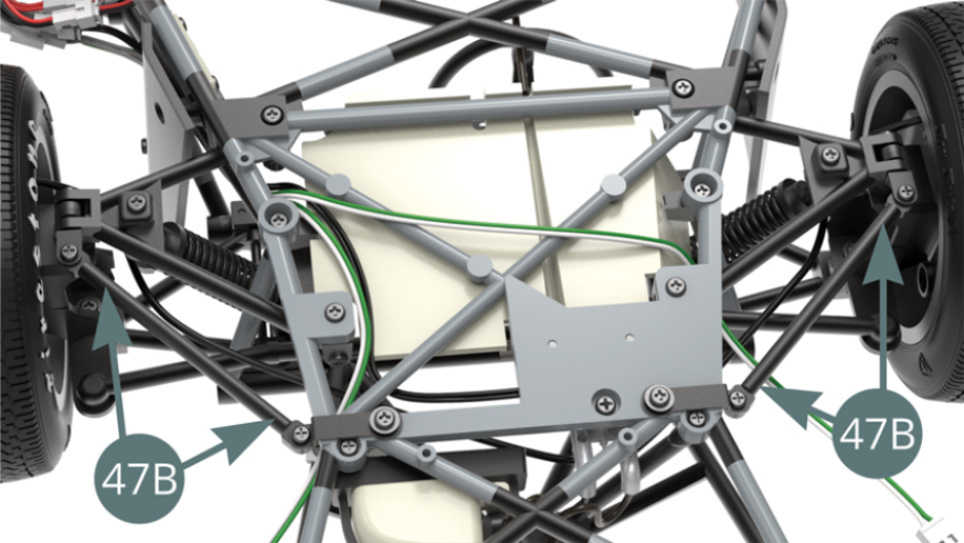 Front lower struts (47B) installed on the front suspension, view from below