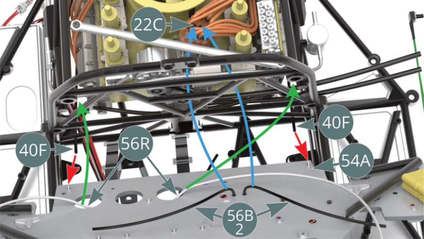 Before attaching the cabin’s bulkhead (54A) to the chassis, connect the two brake lines (40F) to the two nipples at the bottom of the partition (red arrows). Then run the two fire extinguisher hoses (56R) along the upper side tubes of the engine cradle, as indicated by the green arrows in the illustrations opposite. Finally, connect the ends of the two black cables (56B-2) to the two loose ignition wire connectors (22C) on the igniter head as shown by the blue arrows in the illustration above.