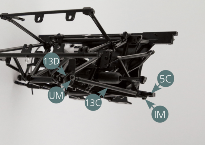 Position the fork-shaped end of the front longitudinal arm (13C) to the bracket (13D) and to the left lower suspension arm (5C). Ensure that each end of the rod (13C) is properly positioned as illustrated. Secure the ring-shaped end of the rod (13C) to the bracket (13D) using a UM screw. Attach the opposite end to the arm (5C) using an IM screw. Insert the IM screw into the lower part of the end (13C) - the widest opening.