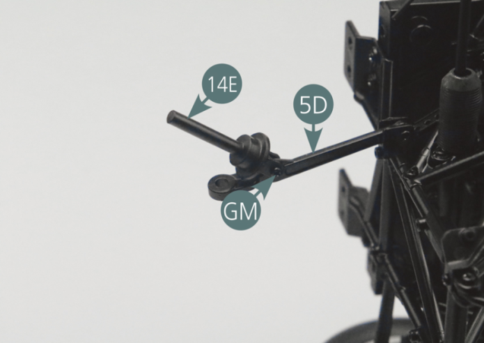 Position the suspension piston pin (14E) on the left lower suspension arm (5C) and fasten it with a GM screw by passing it through the larger opening.