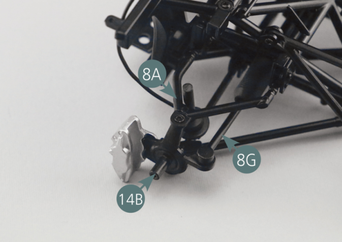 Position the right front pivot (14B) on the upper right suspension arm (8A) and on the steering arm (8G) as illustrated. Secure the wheel pivot (14B) to the upper right suspension arm (8A) using a DM screw. Then use two further DM screws to secure the right front pivot (14B) to the lower right suspension arm (5D) and the steering arm (8G).