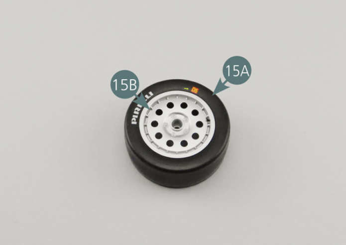 Insert outer rim (15B) into tire (15A) from the side without markings. Turn the tyre over and insert the inner rim (15C) into the tyre, matching the four eye-holes. Now use the four AM screws to fix the outer rim and inner rim together.