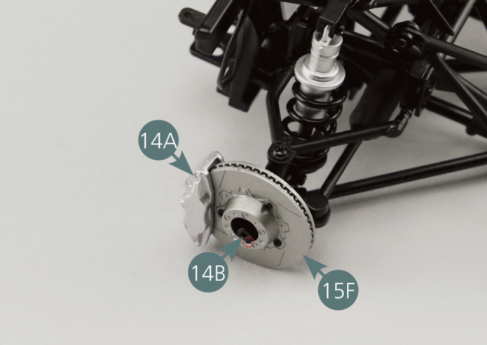 Place the brake disc (15E) on the hub of the right front wheel (14B). The cone in the centre of the disc must face outwards. Pay attention to the small notch.