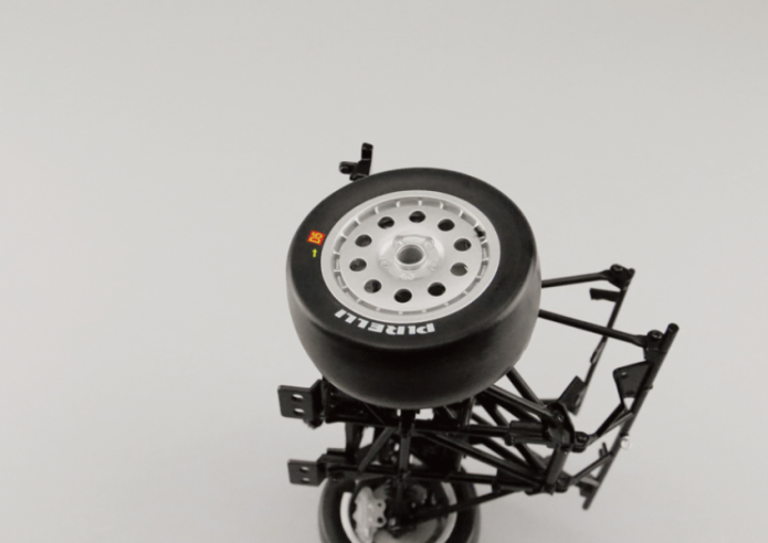 Position the outer wheel rim hub (15B) on the front right pivot pin (14B) and gently rotate the wheel to engage it in the brake disc (15F). Then secure the wheel with a VM screw after passing it through the washer (15D).