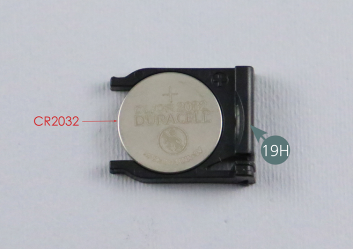 Insert a CR2032 type battery into the holder (19H) - battery not supplied. Insert the battery holder (19H) into the remote control (19F).