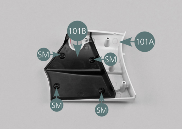 Place the left rear panel (101A) with the inside face facing up. Position the inner panel lining (101B) as shown in the photo and secure it with four SM screws.