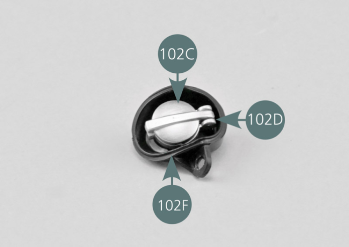 Place the fuel cap and its support in the cap housing (102F) and secure it from the rear with an AP screw as shown in the photo.