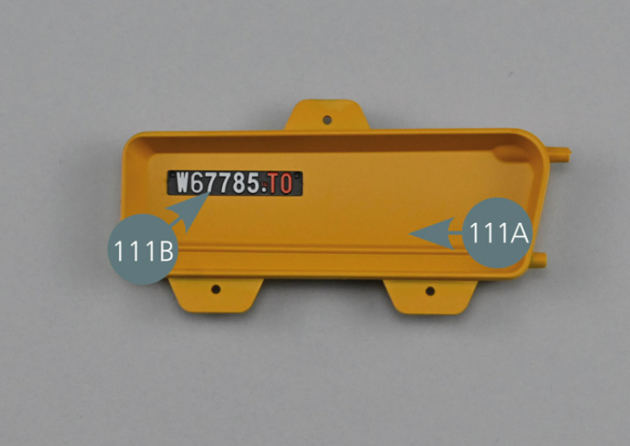 Place the number plate (111B) upside down on the work surface. Remove the protective film from the double-sided adhesive tape. Position the number plate (111B) in the upper left inside corner of the right door inner panel #A (111A). Apply slight pressure so that the double-sided adhesive sticks perfectly.