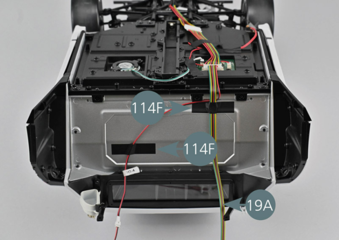 Connect the taillight wire bundle (19A) to the PCB (18C). 