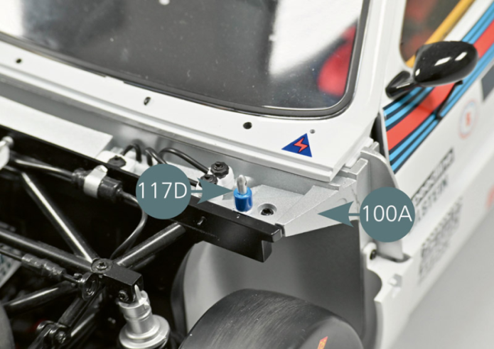 Turn the Lancia 037 upside down and remove the AM screws on the left and right (yellow circle), then put them aside.