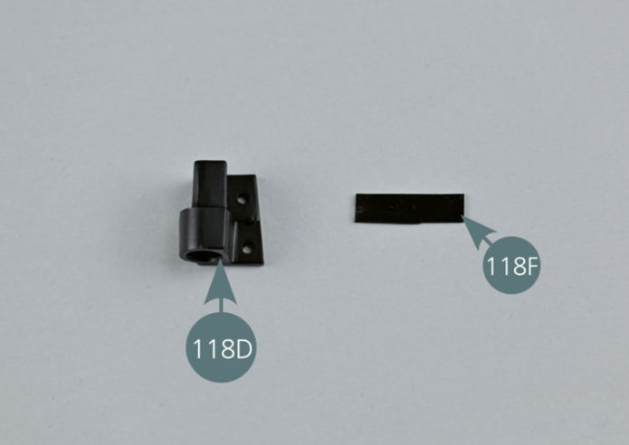 Wind a rubber strip (118F) and insert it into the circular recess in the left hinge of the front cover (118D).