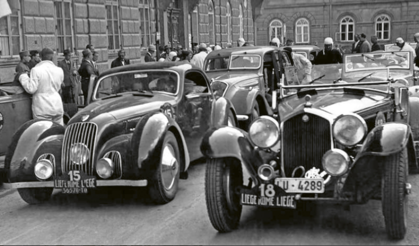 Two Alfa Romeo at the start of the 1937 Liège-Rome-Liège ‘Marathon de la route’: on the left, the 6C 2300 Coupé Pinin Farina driven by Willy Toussaint and Felice Bonetto, and on the right, the 8C 2300 Monza Lungo cabriolet driven by Hugo Dreyer and Max Hahn. © IXO Collections SAS - Tous droits réservés. Crédits photo © Lancia D.R.