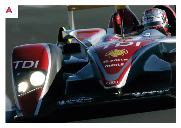A. The upper arms of the front suspension, visible and protected by a carbon cover, are designed to improve aerodynamics, a solution adopted from the 2003 Bentley Speed 8.© IXO Collections SAS - Tous droits réservés. 