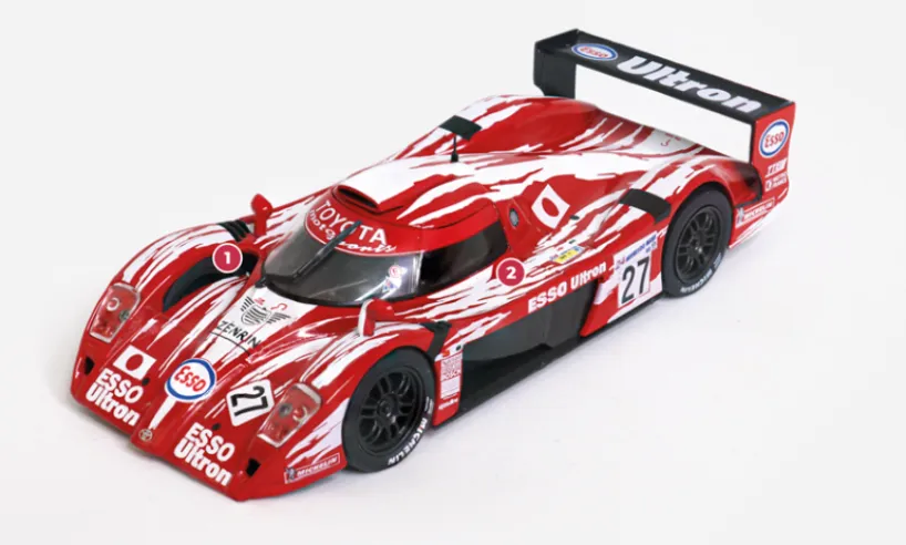 1. The wheel arch apertures serve to reduce air pressure in the wings.2. The body is made of carbon fibre with an aluminium honeycomb structure.© IXO Collections SAS - Tous droits réservés.