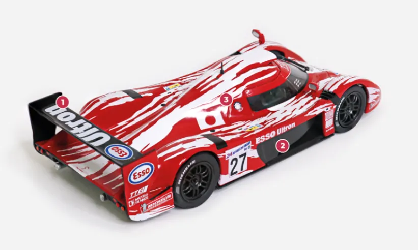 1. The monoplane rear spoiler has a simple shape and minimal incidence, favouring high speeds.2. The large side apertures also help to optimise the escape of air accumulated in the muzzle.© IXO Collections SAS - Tous droits réservés.