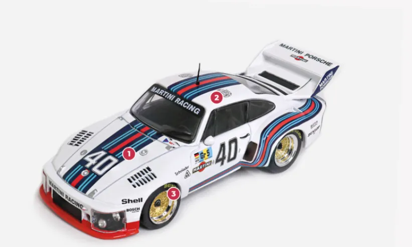 1. Plastic and fibreglass/resin doors and bonnet, and Plexiglas windows reduce the weight to 900 kg. Since the minimum weight imposed on the 4-litre engine category is 970 kg, Porsche takes advantage of this margin to install ballast weights that improve the car's balance.2. The Group 5 regulations require the body of the production model to be retained, hence the name ‘silhouette’ given to this category.3. Thanks to the freedom given by the regulations, Porsche replaced the torsion bars with coil springs and added an adjustable front anti-roll bar.© IXO Collections SAS - Tous droits réservés.