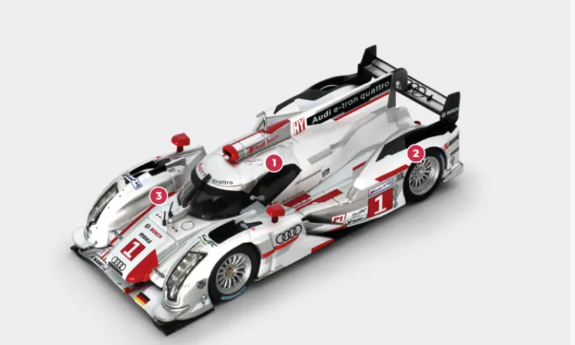 1. The energy recovered during braking is stored in an electric accumulator installed next to the driver and fitted with an additional cooling system.2. The Audi e-tron quattro is derived from the 2011 R18 TDI, which was already designed to accommodate a hybrid system planned for subsequent seasons.3. The e-tron quattro system combines the rear V6 TDI with an electric front axle that uses the energy recovered from braking during acceleration. The regulations stipulate that all-wheel drive may only be activated above 120 km/h.© IXO Collections SAS - Tous droits réservés.