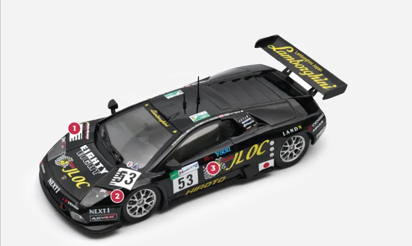 1. The style of the Murciélago R-GT is almost identical to that of the street supercar, except for the highly visible ‘moustaches’ installed on the front wings.2. In technical terms, the main change introduced on the R-GT is the removal of the four-wheel drive system, which requires a major overhaul of the front axle.3. The basic structure remains a tubular lattice, covered with a body made entirely of carbon fibre which, together with the simplification of the mechanics and equipment, contributes to a reduction in weight from nearly 1,700 kg ‘in series’ to 1,100 kg.© IXO Collections SAS - Tous droits réservés. 