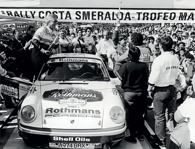 Henri Toivonen (right, raised arm) and Juha Piironen celebrating their victory in the 1984 Costa Smeralda Rally.© IXO Collections SAS - Tous droits réservés.
