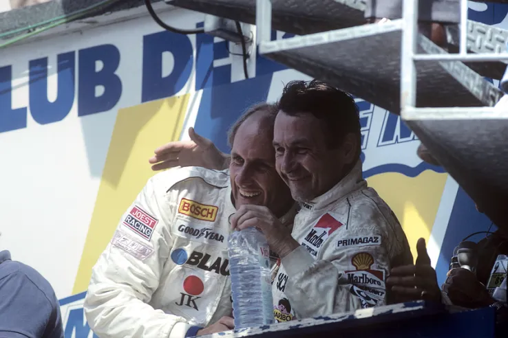 Above, Hans-Joachim Stuck (left) and Bob Wollek celebrate their third place at Le Mans in 1989. They competed together in the 1996 and 1997 editions with Thierry Boutsen as third driver in a 911 GT1 from the official team.© IXO Collections SAS - Tous droits réservés.&nbsp;