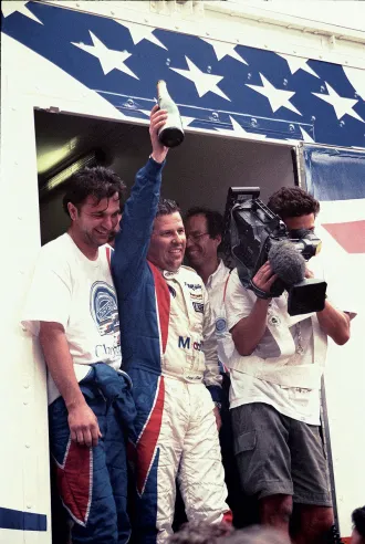 Luca Drudi (centre) celebrates 11th place overall and first in the GT2 class at the 1998 24 Hours of Le Mans with the Oreca team’s Viper © IXO Collections SAS - Tous droits réservés. 