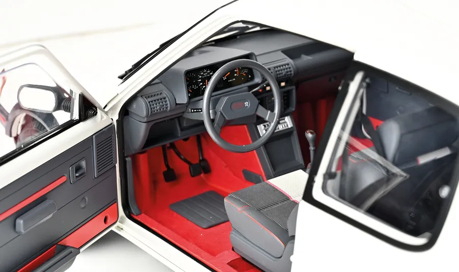 Rediscover the elegance of the Peugeot 205 GTI in its white livery